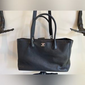 Black Chanel executive bag.